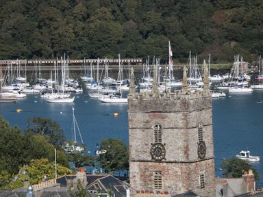 A view of a church tower and boats on water at 36 Crowthers Hill Dartmouth