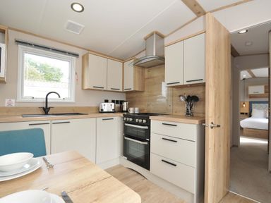 A kitchen with cabinets and appliances at Eden Way 47