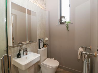 A bathroom with a sink and toilet at 3 bed property 