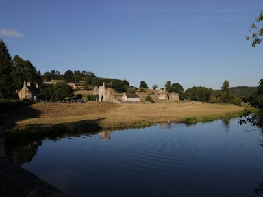 A landscape view with houses and ruins beside a river at 2 Jade side, Malton