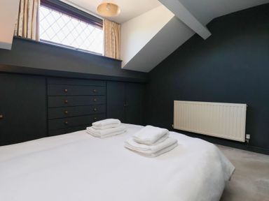 A bedroom with a bed and drawers at West Cottage East Knapton near Rillington