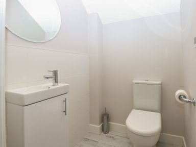 A bathroom with a sink and toilet at 2 Lon Y Dryw in Trearddur Bay