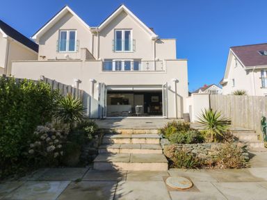 A house with a garden and steps at 2 Lon Y Dryw in Trearddur Bay