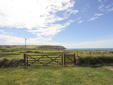 A field with a gate and wind turbine at Ceiriad - 9 Ty'n Don Llanengan near Abersoch