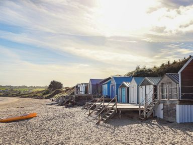A row of beach huts with steps on a sandy beach at Oer - 8 Ty'n Don Llanengan near Abersoch