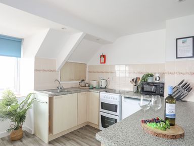 A kitchen with appliances and utensils at Ysgo - 6 Ty'n Don Abersoch
