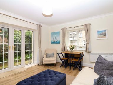 A living room with a dining table and seating area at 2 Sheplegh Court Blackawton near Dartmouth