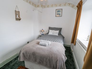 A bedroom with bed and lamp at The Old Post Office in null