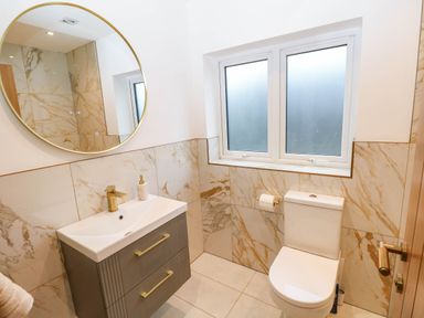 A bathroom with a sink and toilet at Hawthorns