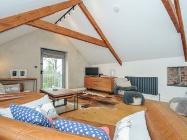 A living room with a sofa and coffee table at The Dairy in 
