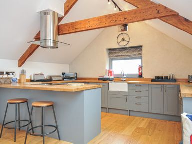 A kitchen with a counter and sink at The Dairy in 