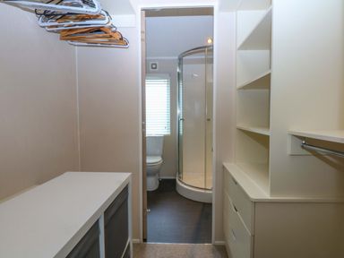 A bathroom with a shower and toilet at The Hideaway Pwllheli