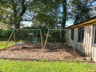 A swing set in a garden at Knap Cottage in Clarbeston Road
