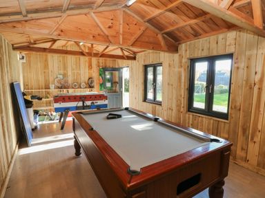A games room with a pool table and foosball table at Stable Cottage in Clarbeston Road