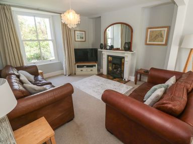 A living room with sofas and a television at Pedn Brose Near Mousehole