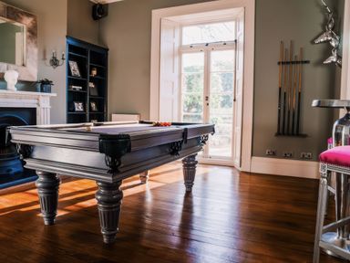 A game room with a pool table at St Anne's Manor in Torquay
