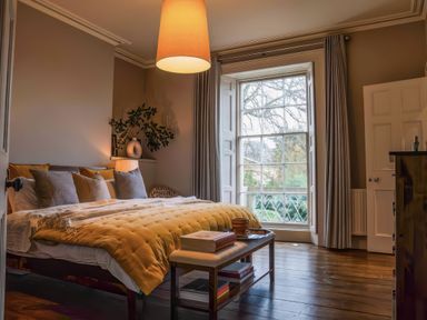 A bedroom with a bed and lamp at St Anne's Manor in Torquay