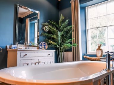 A bathroom with a sink and bathtub at St Anne's Manor in Torquay