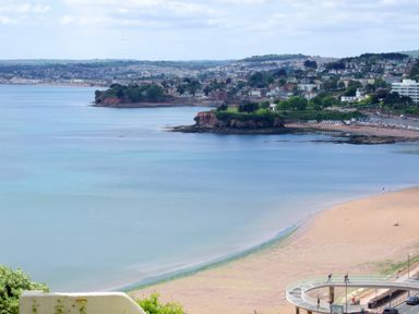 A view of the beach and coast at Upper Stable - The Stables Apartments at Meadfoot Bay Torquay