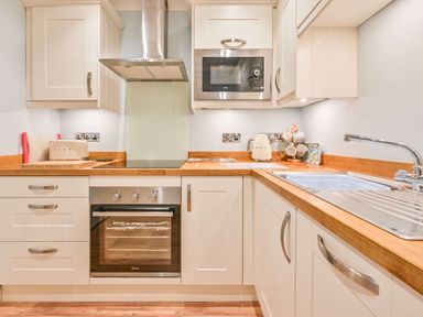 A kitchen with a sink and appliances at Muntham - Studio Apartment 7 Torquay