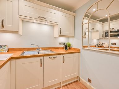 A kitchen with a sink and cupboard at Muntham - Studio Apartment 7 in Torquay