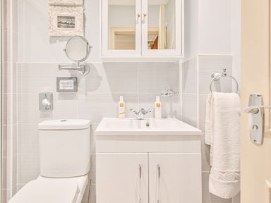 A bathroom with a sink and toilet at Muntham - Studio Apartment 7 in Torquay