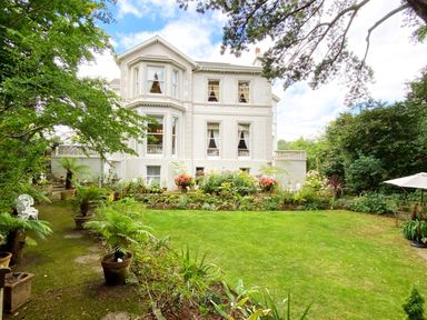A house with garden and flowers at Muntham - Studio Apartment 7, Torquay