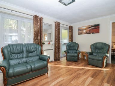 A living room with two armchairs and a sofa at Willow Lodge near Liskeard