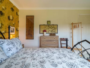 A bedroom with a bed and dresser at Apple Byrd in Kendal