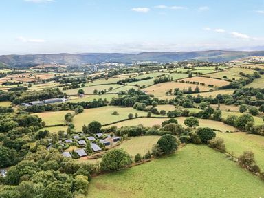 Scenic landscape with fields and trees at Oak View Rhayader