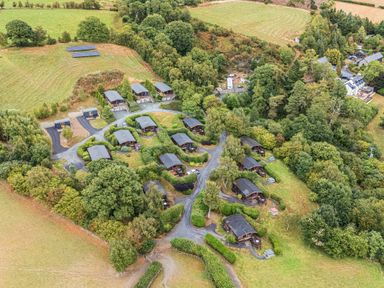 An outdoor area with cabins and trees at Oak View Rhayader