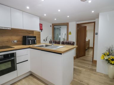 A kitchen with a sink and appliances at Park View Studio in Ambleside