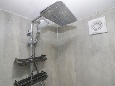 A shower with a rain showerhead at Park View Studio in Ambleside