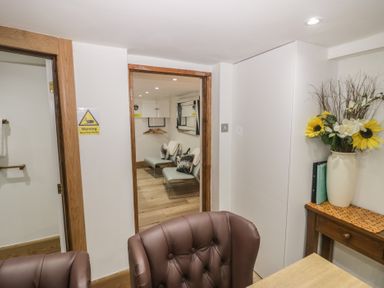 An office space with a chair and table at Park View Studio in Ambleside