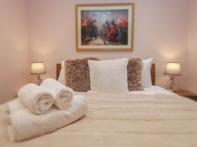 A bedroom with a bed and pillows at Park View in Ambleside