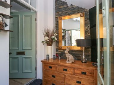 An entryway with a door and chest of drawers at Park View in Ambleside