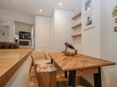 A kitchen with a table and chairs at Park View in Ambleside