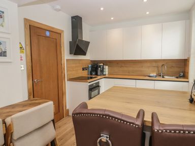 A kitchen with a sink and stove at Park View in Ambleside
