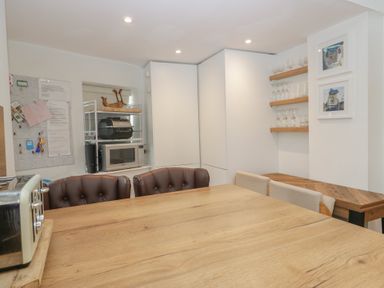 A kitchen with a dining table and chairs at Park View in Ambleside
