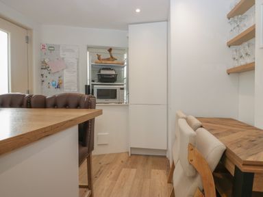 A kitchen with a table and chairs at Park View in Ambleside