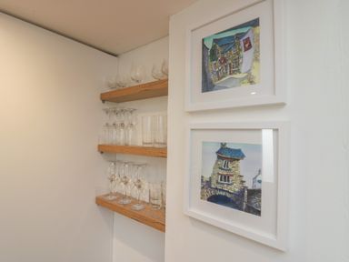Shelves with glassware and framed artwork at Park View in Ambleside