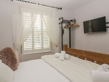 A bedroom with a bed and window at Park View in Ambleside