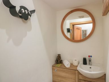A bathroom with a sink and mirror at Park View in Ambleside