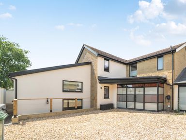 A house exterior with gravel driveway at Manor Farm House in Merton near Bicester