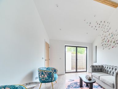 A living room with a sofa and chairs at Manor Farm House in Merton near Bicester