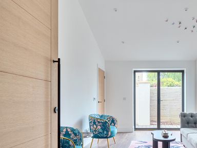A living room with armchairs and a table at Manor Farm House in Merton near Bicester