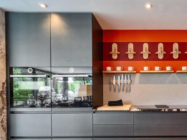 A kitchen with built-in appliances and knife storage at Manor Farm House in Merton near Bicester