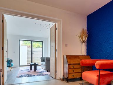 A living room with a chair and sofa at Manor Farm House in Merton near Bicester