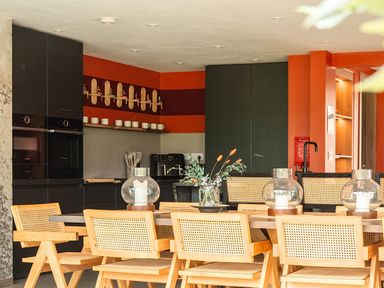 A kitchen with dining area and modern appliances at Manor Farm House in Merton near Bicester
