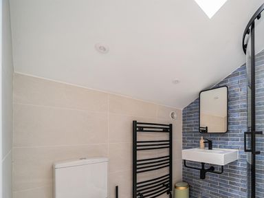 A bathroom with a sink and towel rail at Manor Farm House in Merton near Bicester